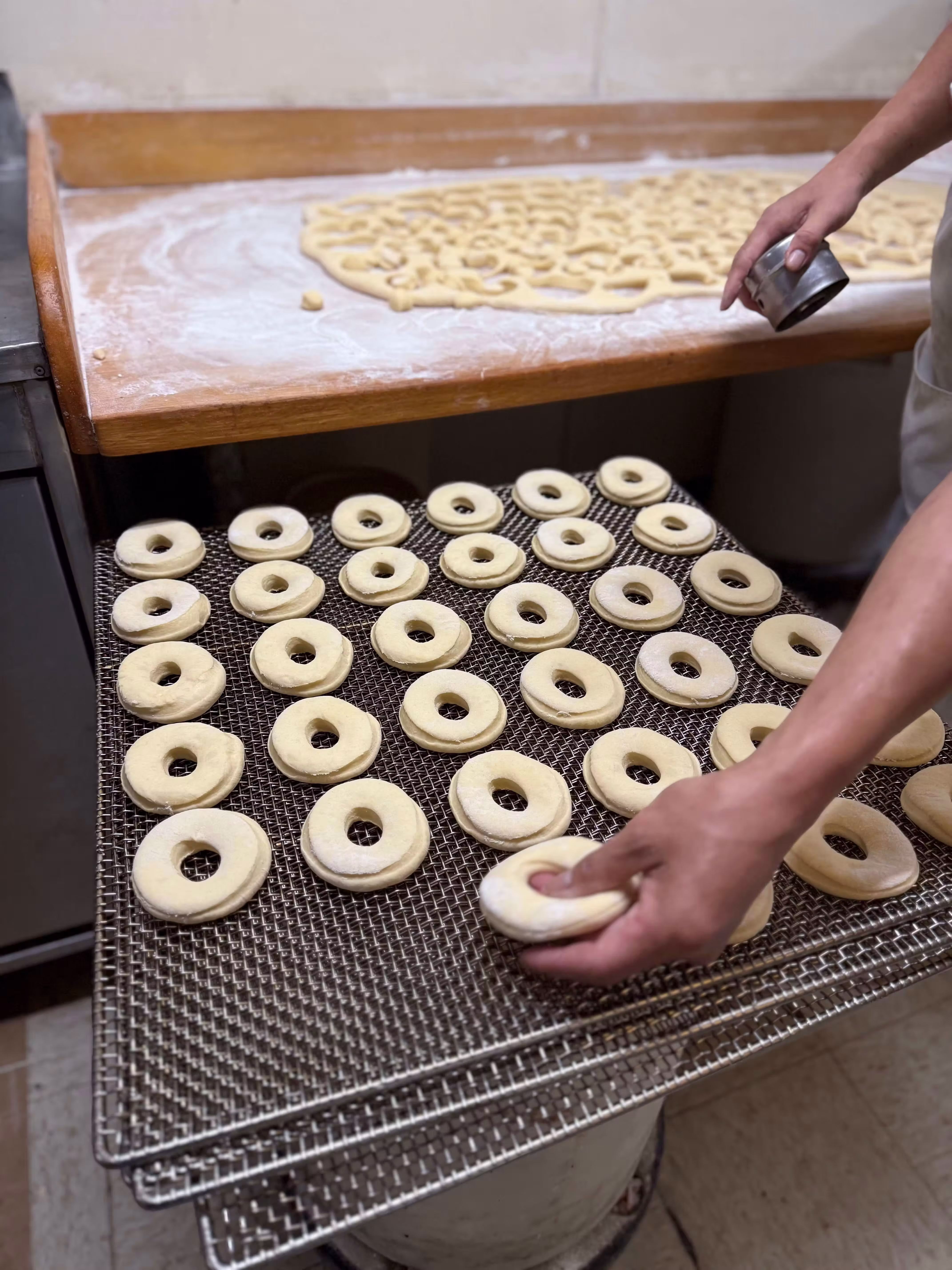 Cutting fresh donuts